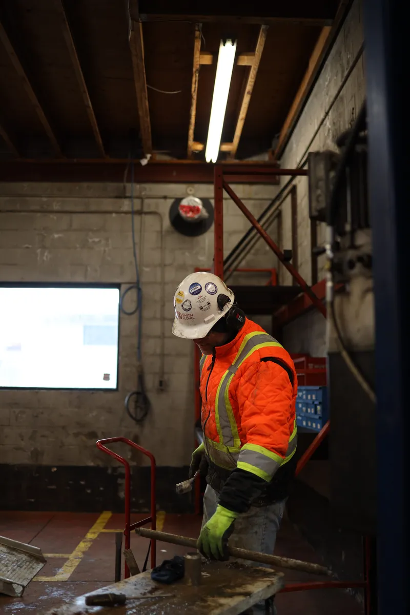 Working alone at the bench in a service bay
